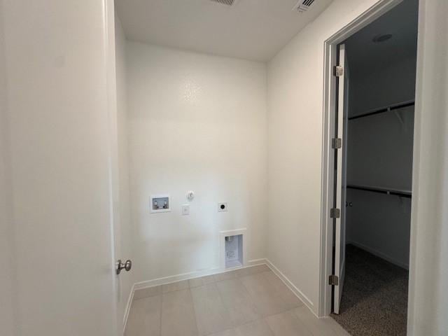 2705 Sage Ranch Dr Unit 24, Leander, TX 78641 - washroom with hookup for an electric dryer, washer hookup, hookup for a gas dryer, and light tile patterned flooring