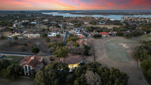 bird's eye view featuring a water view and a residential view