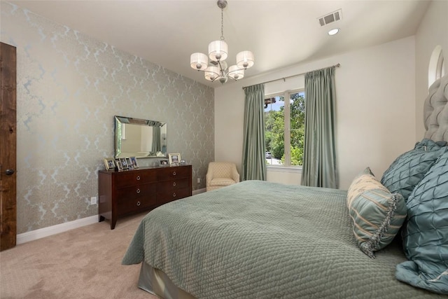 bedroom with a chandelier, baseboards, visible vents, and light colored carpet