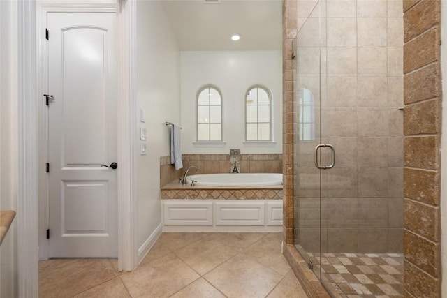 5807 City Park Rd Unit 14, Austin, TX 78730 - bathroom with a garden tub, tile patterned flooring, a stall shower, and recessed lighting