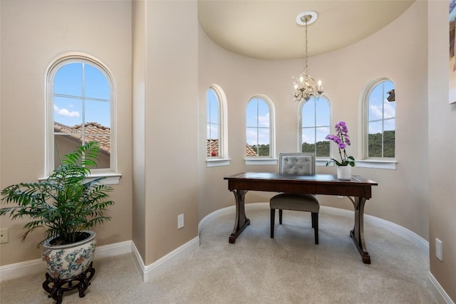 carpeted office with an inviting chandelier and baseboards