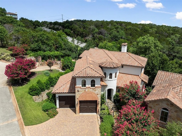 aerial view featuring a wooded view