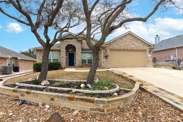 view of front of property with a garage, central AC, concrete driveway, and brick siding