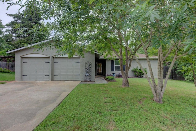 single story home with an attached garage, concrete driveway, brick siding, and a front yard