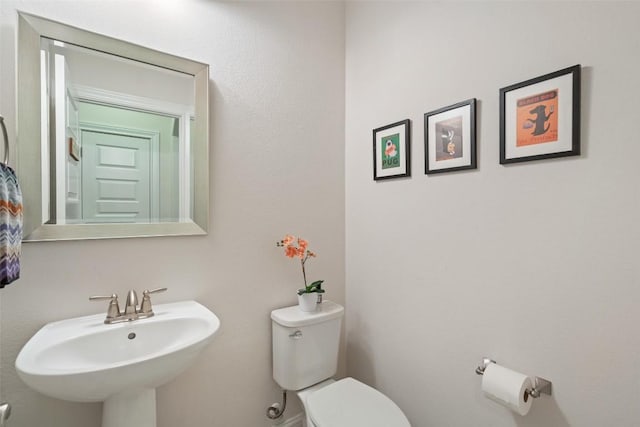 bathroom with a sink and toilet