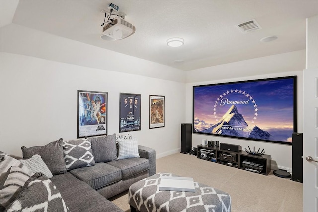 home theater room with carpet floors, baseboards, visible vents, and lofted ceiling