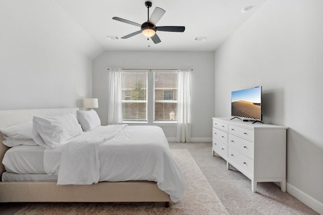 bedroom featuring baseboards, visible vents, and light colored carpet