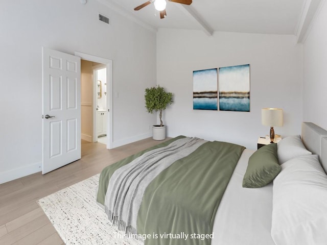 bedroom featuring lofted ceiling with beams, light wood-type flooring, visible vents, and baseboards