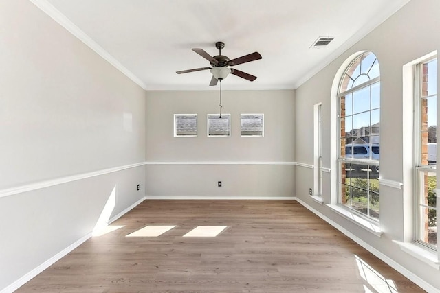 unfurnished dining area featuring visible vents, light wood-style flooring, and baseboards