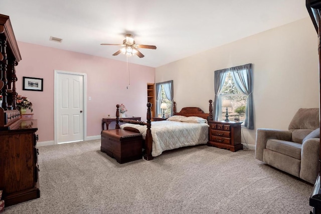 bedroom featuring a ceiling fan, carpet, visible vents, and baseboards