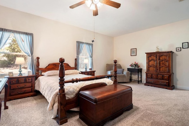 bedroom featuring carpet flooring, ceiling fan, visible vents, and baseboards