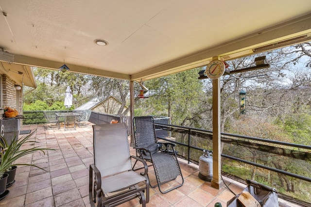 view of patio featuring outdoor dining area