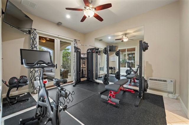 workout room featuring a wall unit AC, recessed lighting, visible vents, ceiling fan, and baseboards