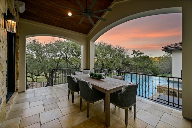 view of patio with a ceiling fan and outdoor dining space