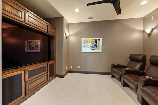 cinema room with ceiling fan, recessed lighting, light colored carpet, visible vents, and baseboards