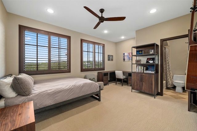 bedroom featuring light carpet and recessed lighting