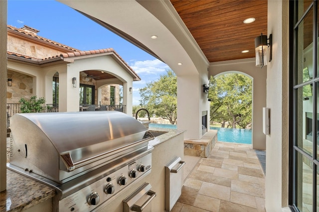 view of patio with a grill and area for grilling