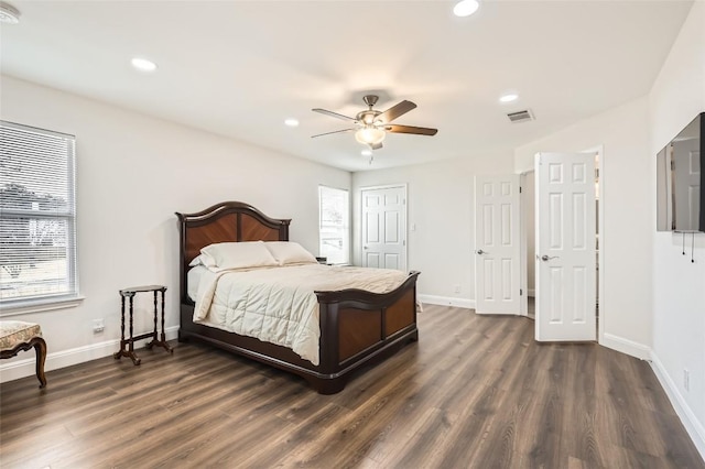 bedroom featuring visible vents, baseboards, dark wood-style flooring, and recessed lighting