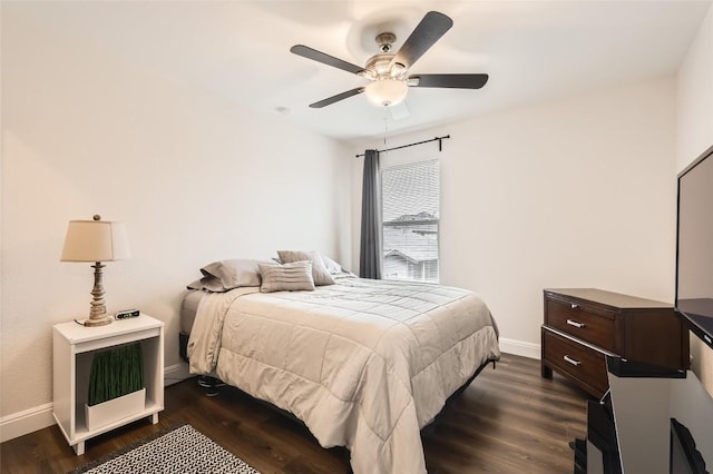 bedroom featuring dark wood-style floors, ceiling fan, and baseboards