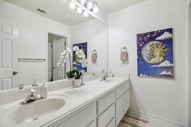 3304 Mulberry Creek Dr, Austin, TX 78732 - bathroom featuring double vanity and baseboards