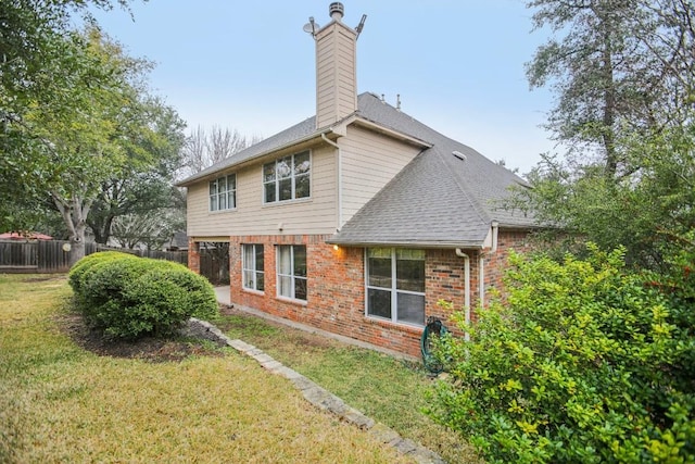 3304 Mulberry Creek Dr, Austin, TX 78732 - back of property with brick siding, a shingled roof, and a chimney