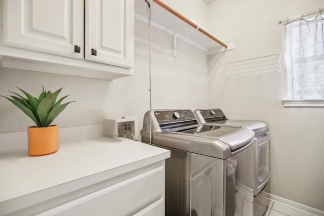 3304 Mulberry Creek Dr, Austin, TX 78732 - laundry room featuring washing machine and dryer, cabinet space, and light tile patterned floors