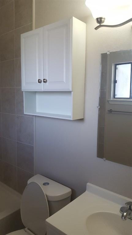 full bathroom with vanity and toilet