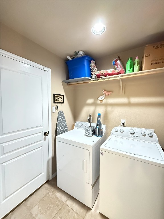 clothes washing area with laundry area and washer and clothes dryer