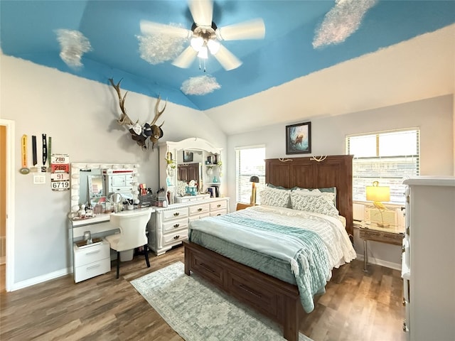 bedroom with a ceiling fan, baseboards, vaulted ceiling, and dark wood-type flooring