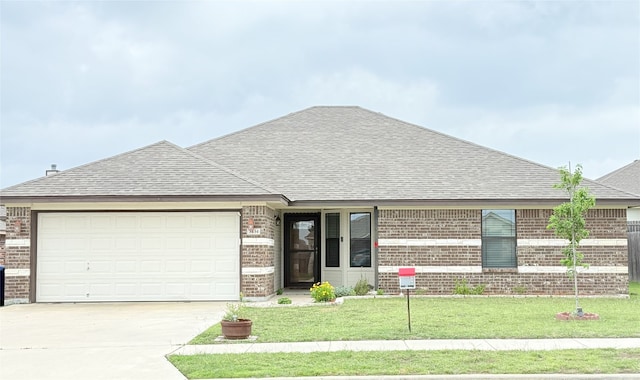 view of front of home with concrete driveway, brick siding, and roof with shingles