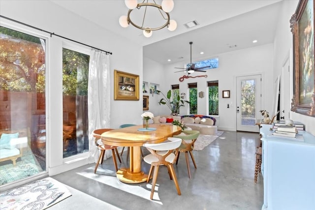 2115 Uphill Ln Unit A, Austin, TX 78741 - dining room with finished concrete floors, a ceiling fan, recessed lighting, a high ceiling, and baseboards