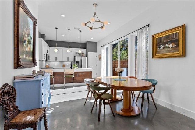 2115 Uphill Ln Unit A, Austin, TX 78741 - dining space featuring concrete floors, recessed lighting, an inviting chandelier, and baseboards