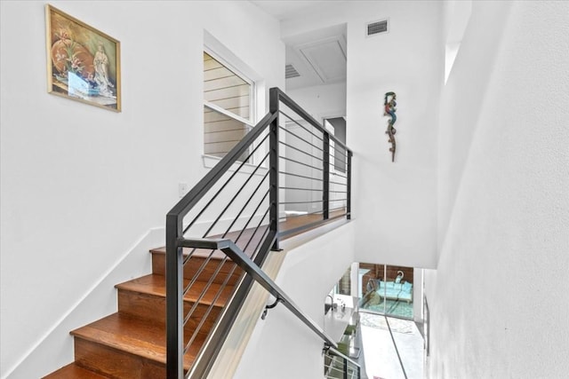 2115 Uphill Ln Unit A, Austin, TX 78741 - stairway featuring a towering ceiling