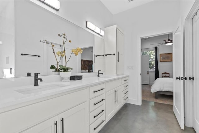 2115 Uphill Ln Unit A, Austin, TX 78741 - full bath featuring double vanity, ensuite bath, concrete flooring, and a ceiling fan