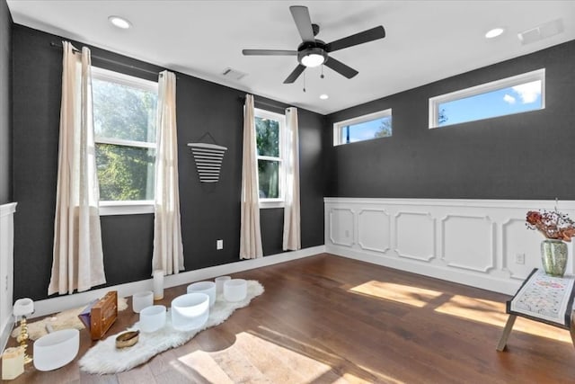 2115 Uphill Ln Unit A, Austin, TX 78741 - spare room featuring wood finished floors, a ceiling fan, and recessed lighting