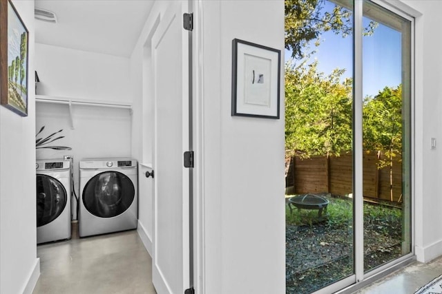 2115 Uphill Ln Unit A, Austin, TX 78741 - laundry area featuring separate washer and dryer and baseboards