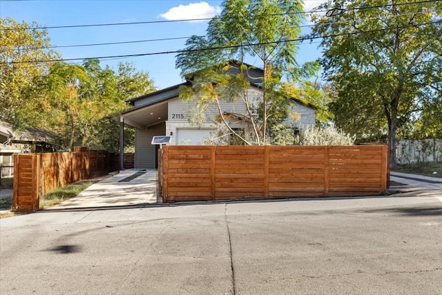 2115 Uphill Ln Unit A, Austin, TX 78741 - view of front of house with driveway and fence
