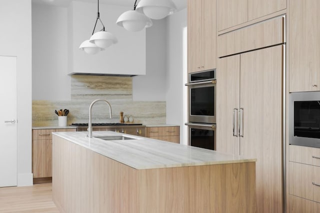 3614 Murillo Cir, Austin, TX 78703 - kitchen featuring modern cabinets, double oven, light brown cabinetry, light stone counters, and tasteful backsplash