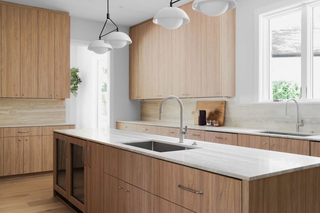3614 Murillo Cir, Austin, TX 78703 - kitchen with a sink, tasteful backsplash, and light stone countertops