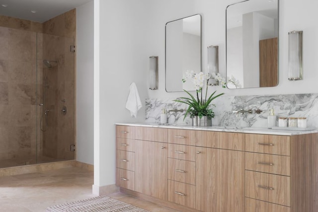 full bathroom with double vanity, decorative backsplash, tile patterned flooring, and a stall shower