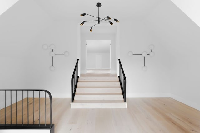 3614 Murillo Cir, Austin, TX 78703 - stairway featuring a chandelier, wood finished floors, and baseboards