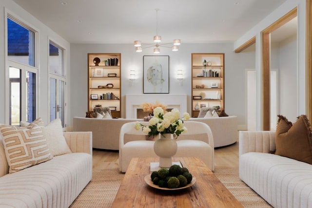 interior space featuring wood finished floors and built in shelves