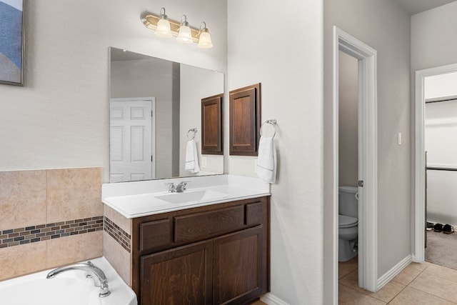 full bath featuring tile patterned flooring, toilet, a bath, and vanity