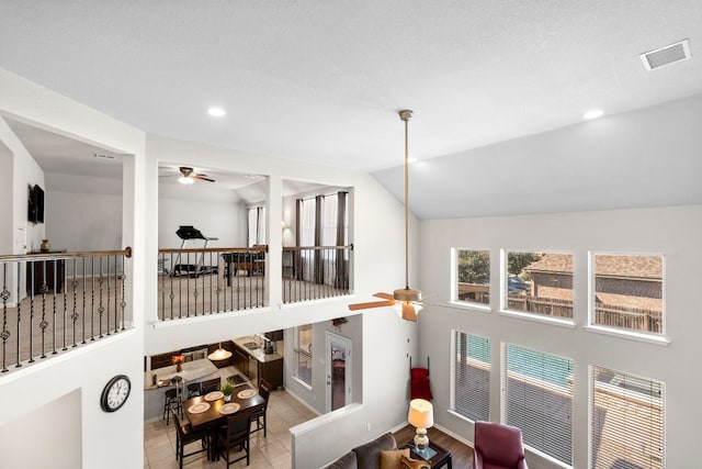 19900 Kite Wing Ter, Pflugerville, TX 78660 - corridor featuring recessed lighting, vaulted ceiling, baseboards, and tile patterned flooring
