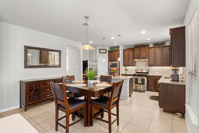 dining room featuring light tile patterned flooring, baseboards, visible vents, and recessed lighting
