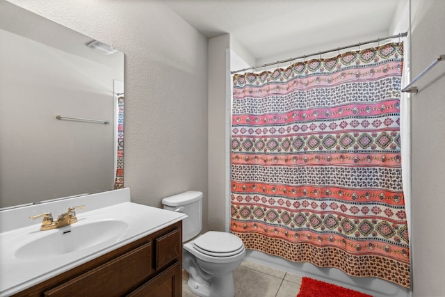 full bath featuring toilet, tile patterned flooring, vanity, and a shower with shower curtain
