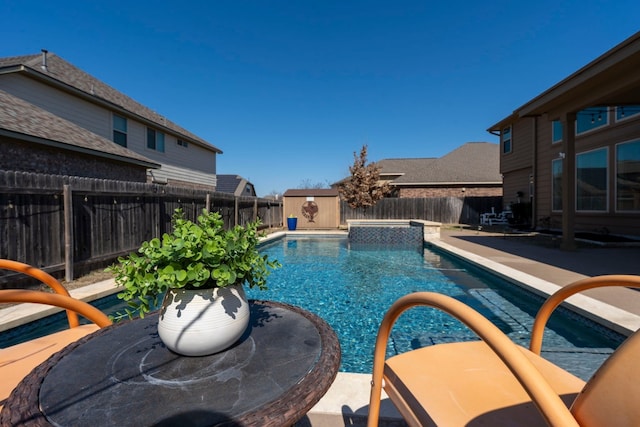 view of swimming pool with a pool with connected hot tub, a patio, a storage shed, and a fenced backyard