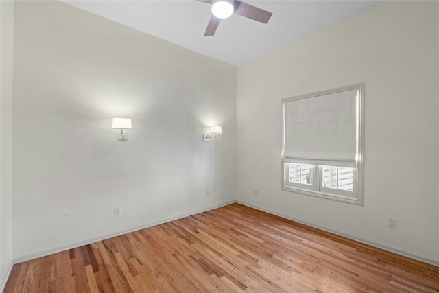 spare room featuring light wood finished floors and ceiling fan