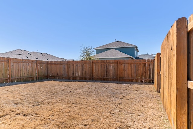 view of yard featuring a fenced backyard