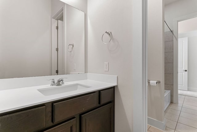 full bathroom featuring bathtub / shower combination, tile patterned flooring, vanity, and baseboards